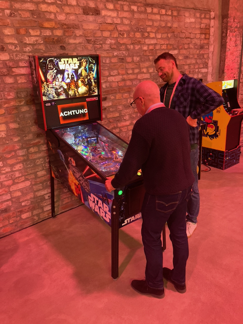 Gristers playing pinball.